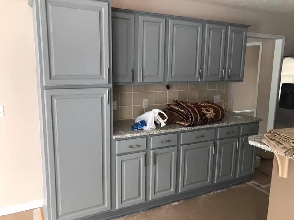 Kitchen cabinets refinished in white by Gladiators Painting